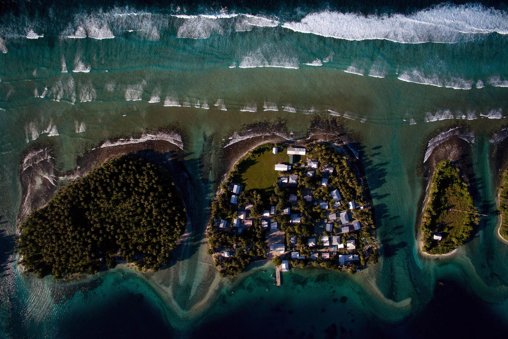 Homes on Ejit, an islet in the Majuro Atoll, Marshall Islands, pictured on Oct. 29, 2015, are under threat from rising seas. (Josh Haner/The New York Times)