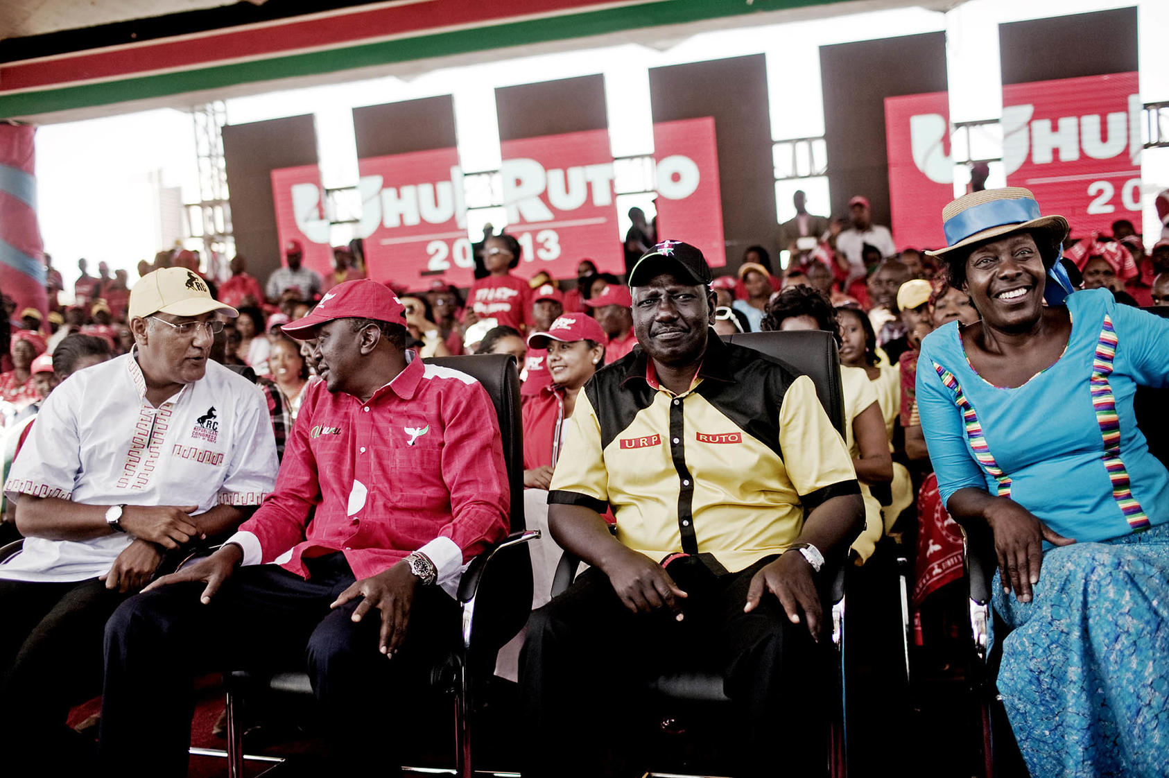 Kenya’s new president William Ruto (second from right) sits with former President Uhuru Kenyatta (second from left) at a campaign rally in 2013, when Ruto ran as Kenyatta’s deputy. (Pete Muller/The New York Times)