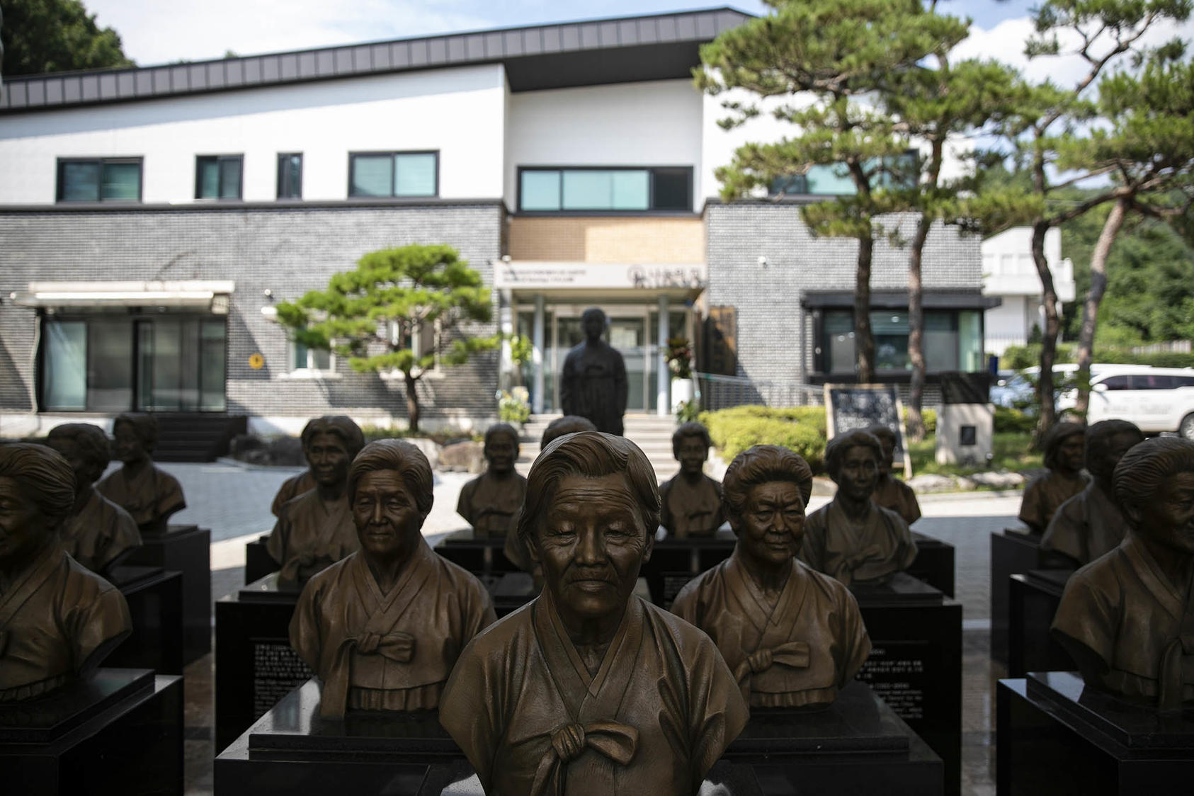Bronze busts of former sex slaves, or “comfort women,” for Japanese troops in World War II, at the House of Sharing shelter in Gwangju, South Korea. July 3, 2022. (Woohae Cho/The New York Times)