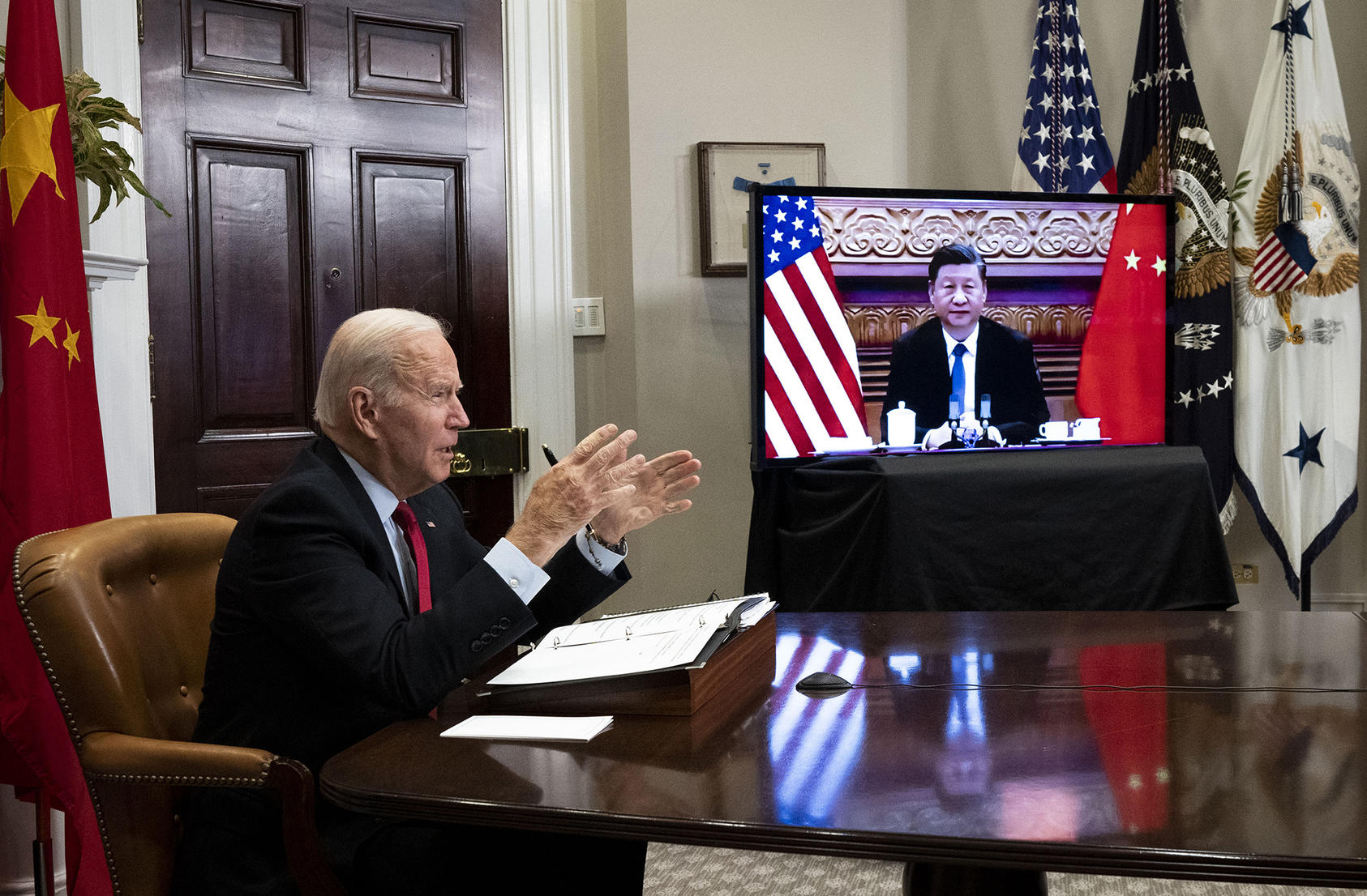 President Joe Biden takes notes during a video summit with President Xi Jinping of China at the White House on Nov. 15, 2021. The personal relationship between the two leaders could help stabilize relations between the two nations. (Doug Mills/The New York Times)