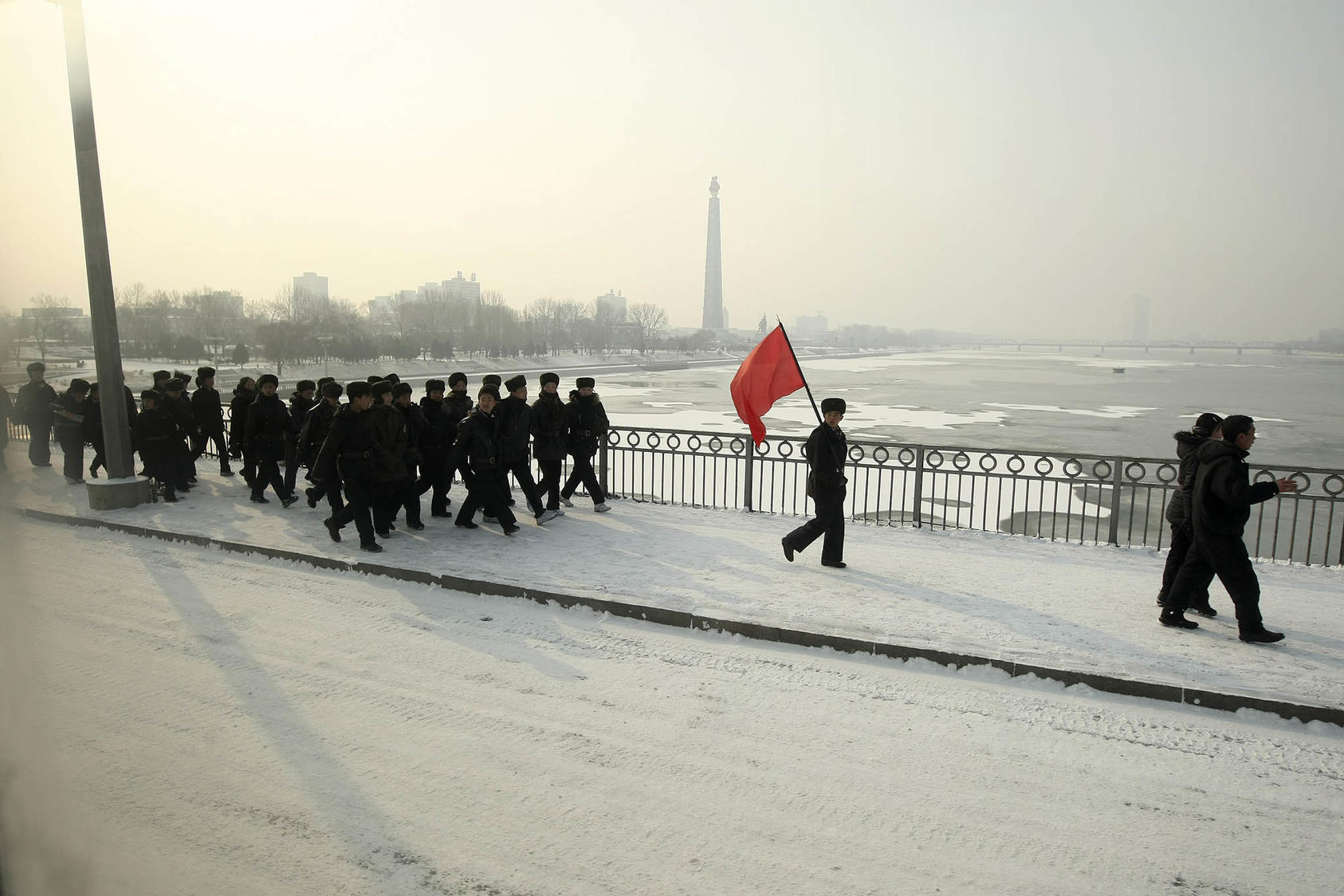 Soldiers cross a bridge over the Dae Dong river, in Pyongyang, North Korea, Feb. 26, 2008. (Chang W. Lee/The New York Times)