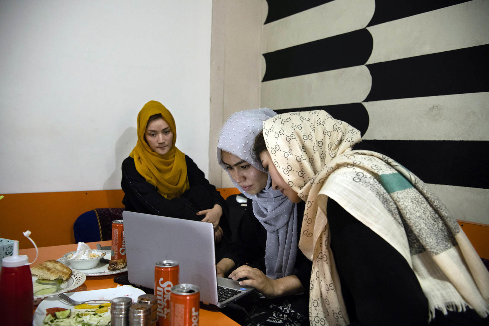 Kabul University students study for an August final exam in the women’s room of a restaurant. This month, Taliban expelled female university students suspected of joining protests and barred many more girls from classes. (Kiana Hayeri/The New York Times)