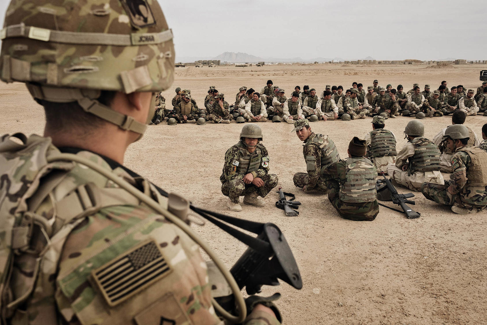 American soldiers overseeing training of their Afghan counterparts at Camp Bastion in Helmand Province, Afghanistan, March 22, 2016. (Adam Ferguson/The New York Times)
