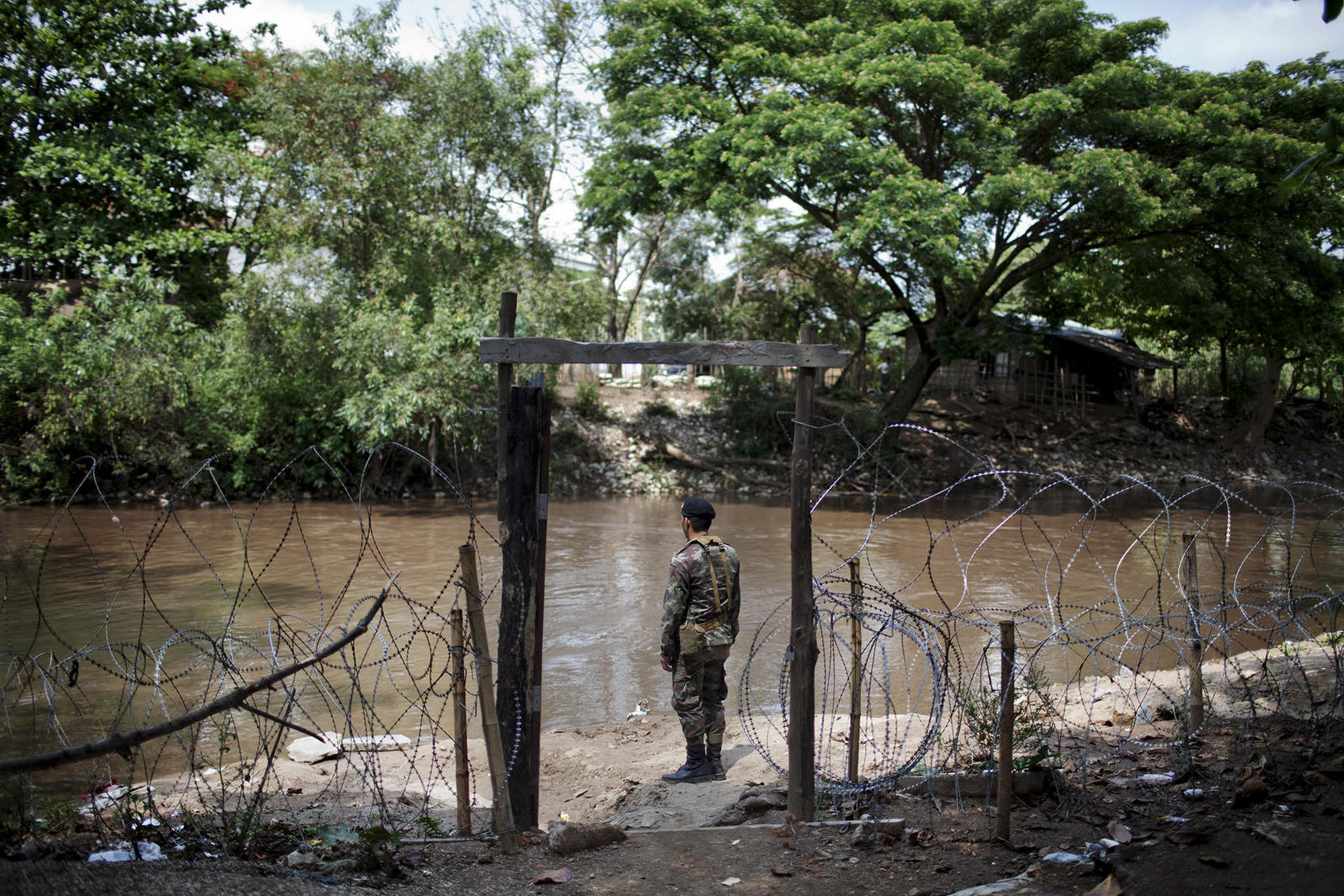 A soldier at a military checkpoint along the Sai River, which borders Myanmar, in Mae Sai, Thailand, May 9, 2012. (Giulio Di Sturco/International Herald Tribune)