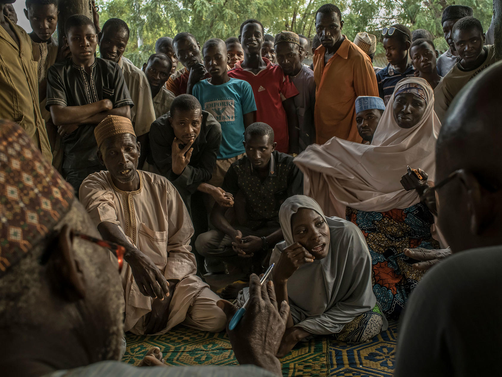 Saadia, who was six months pregnant, outlines to Judge Alkali Laouali Ismaël, left, her reasons for wanting a divorce, in Maradi, Niger, April 4, 2017.