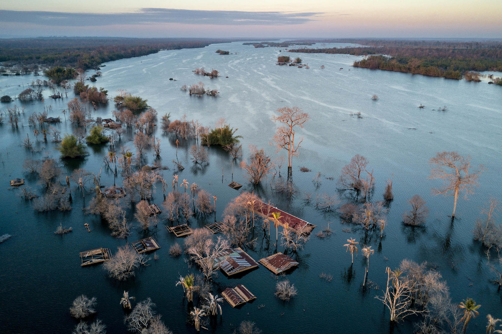 Srekor village was submerged when the reservoir for the Lower Sesan 2 Dam began filling up in late 2017, in Cambodia on Dec. 6, 2018. (Sergey Ponomarev/The New York Times)