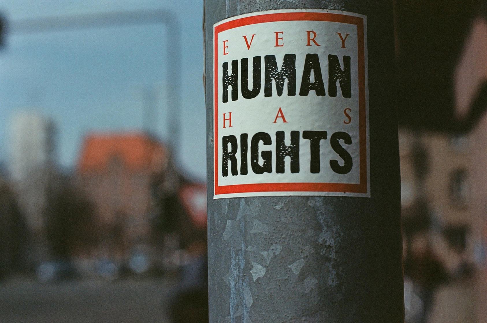 "Every Human Has Rights" sign on pole