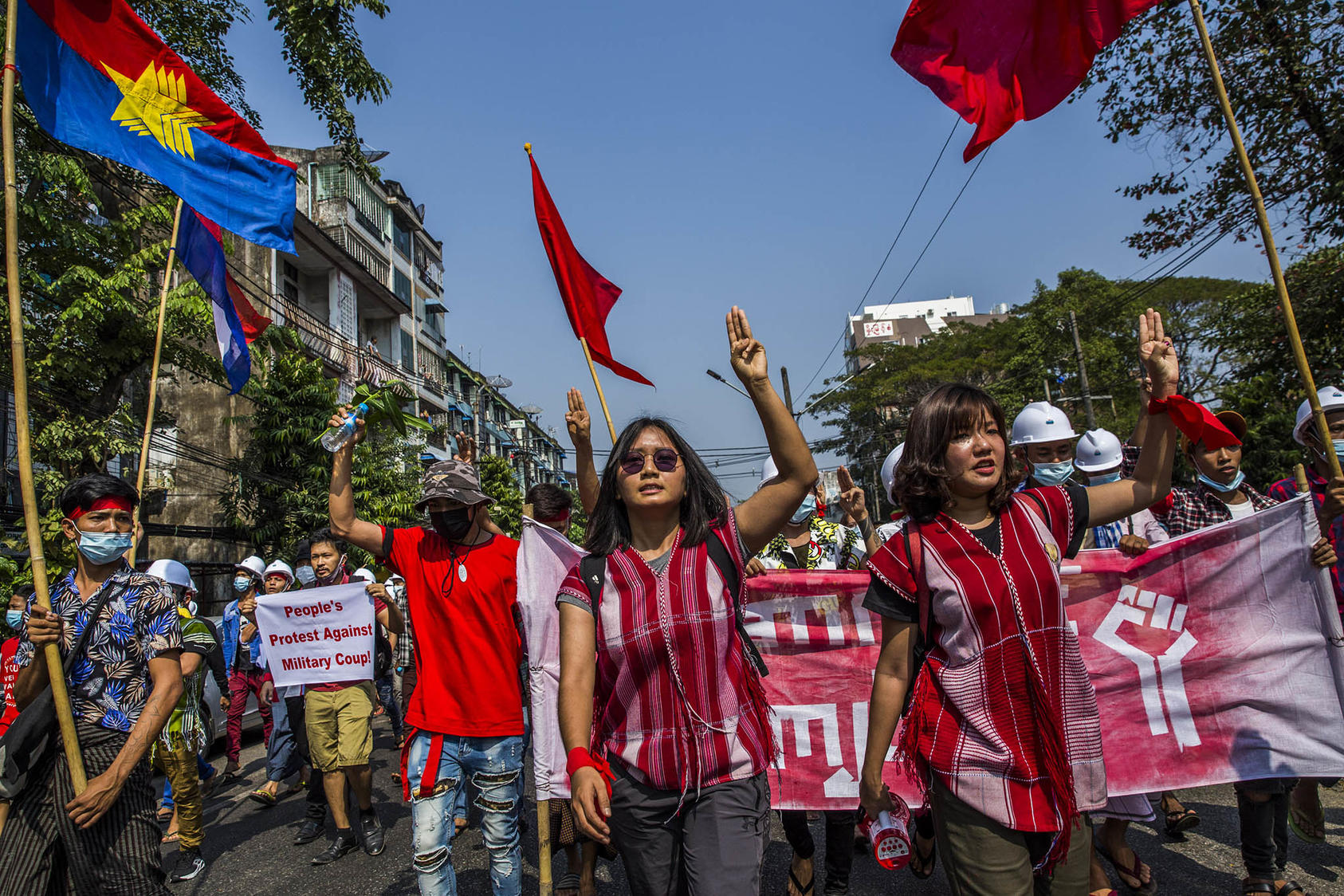 Esther Ze Naw and Ma Ei Thinzar Maung lead a rally to protest the recent military coup, in Yangon, Myanmar, Feb. 6, 2021. (The New York Times)