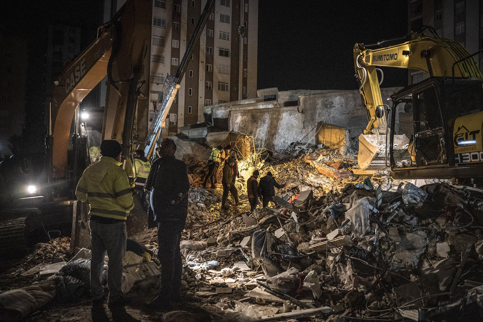 Emergency personnel during a search and rescue operation at the site of a collapsed building after an earthquake in Adana, Turkey, on Feb. 7, 2023. (Sergey Ponomarev/The New York Times)