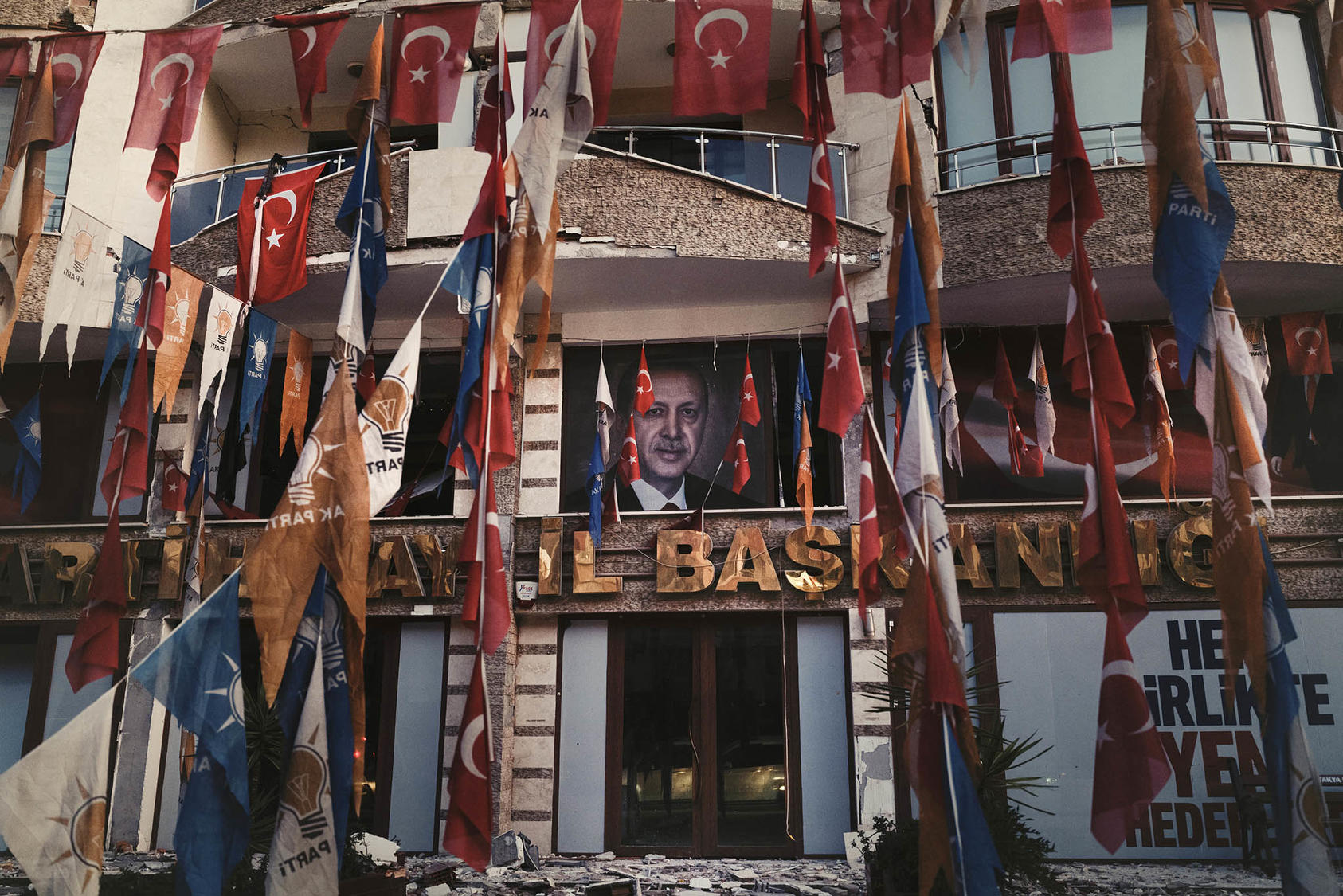 An office of President Recep Tayyip Erdogan’s political party displays flags and his photo ahead of Turkey’s coming election. The vote and recent earthquake weigh amid talks with Turkey on Sweden joining NATO. (Emily Garthwaite/The New York Times)