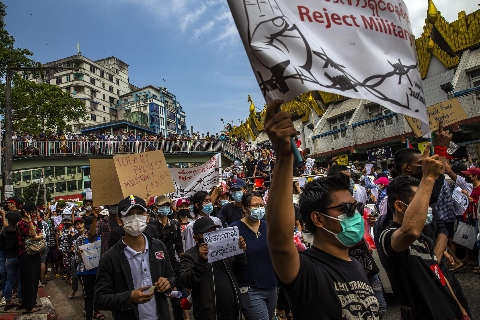 People march in Yangon, Myanmar, on Monday, Feb. 8, 2021, in protest to the recent military coup. The military seized power in a coup on Feb. 1, and detained the country’s elected civilian leaders. (The New York Times)