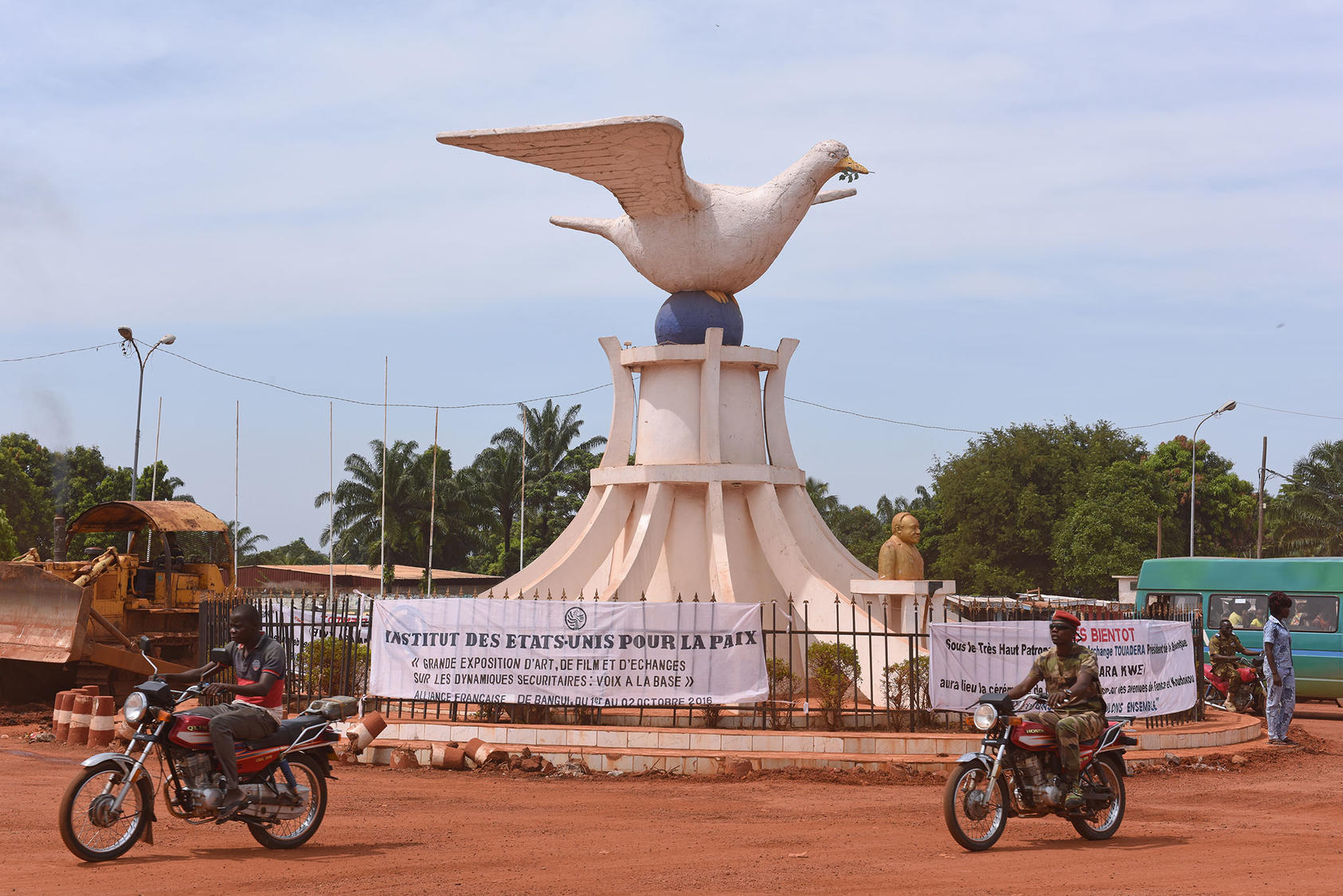 This peace dove statue, marking the Place de la Reconciliation, in Bangui, Central African Republic. The sign reads (in French), "United States Institute of Peace Grand Exhibition of Art, Film, and Exchange," (Photo: USIP)