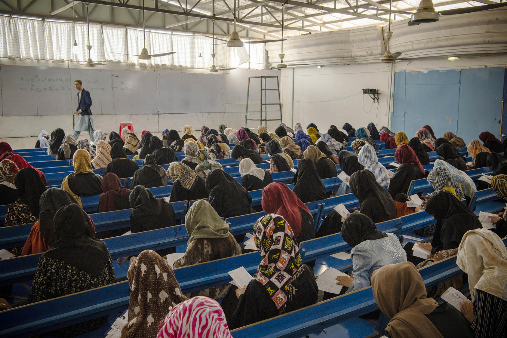 Girls prepare for the university entrance exam, Mazar-e-Sharif, Afghanistan, Oct. 8, 2021. Afghan girls are now barred from taking these entrance exams and attending high school or college. (Kiana Hayeri/The New York Times)