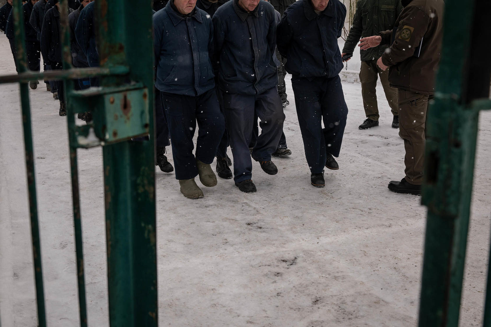 Russian prisoners of war walk in formation at a camp in western Ukraine. Ukraine has given U.N. monitors access to POWs it holds, as required by the Geneva Conventions. Russia has refused all access. (Nicole Tung/The New York Times)