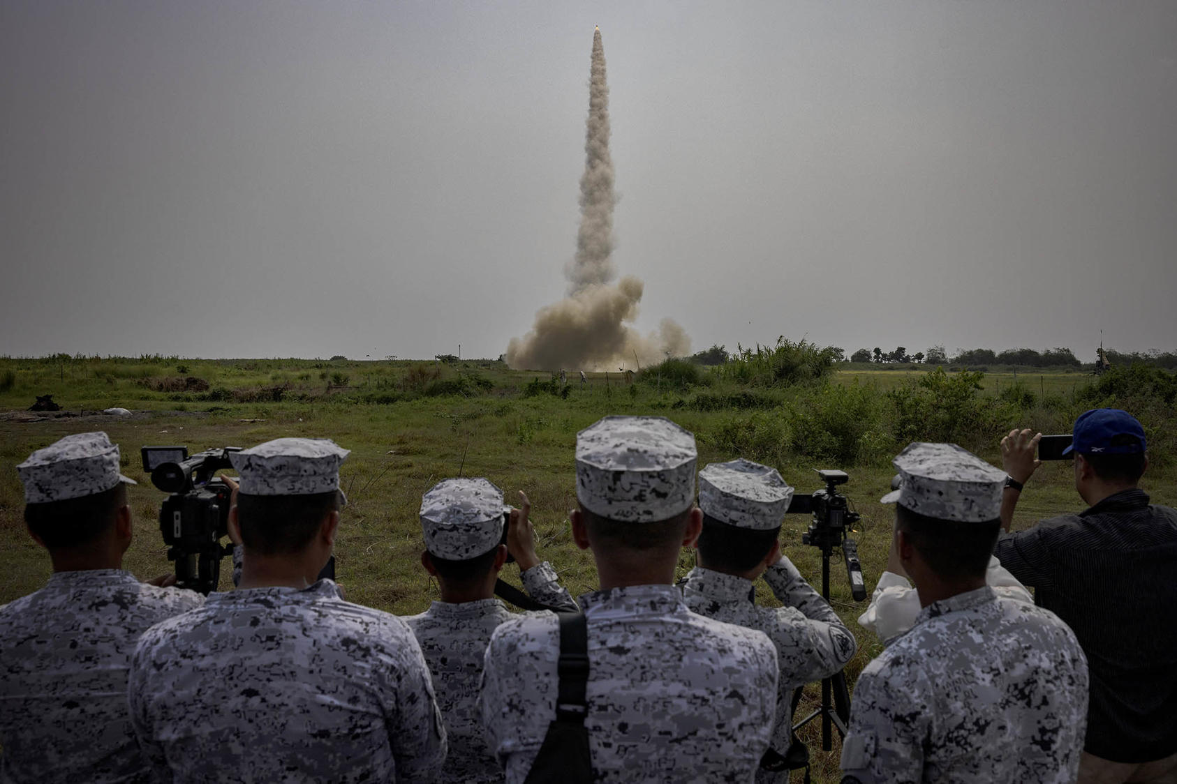 Philippine Navy officers watch a Patriot surface-to-air missile fired during joint exercises with U.S. forces in San Antonio, Philippines, on Tuesday, April 25, 2023. (Ezra Acayan/The New York Times)