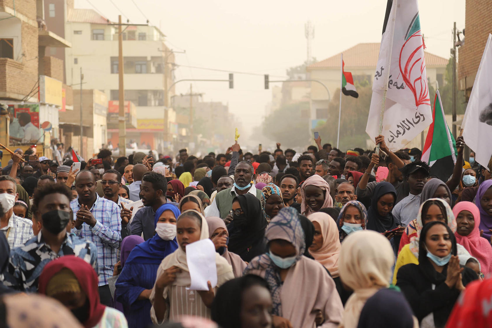 Sudanese, most of them youth, fill a Khartoum street in January 2022 amid the pro-democracy campaign seeking an end to military rule. Youth are leading in the civilian response to the current military infighting. (Faiz Abubakar Muhamed/The New York Times)