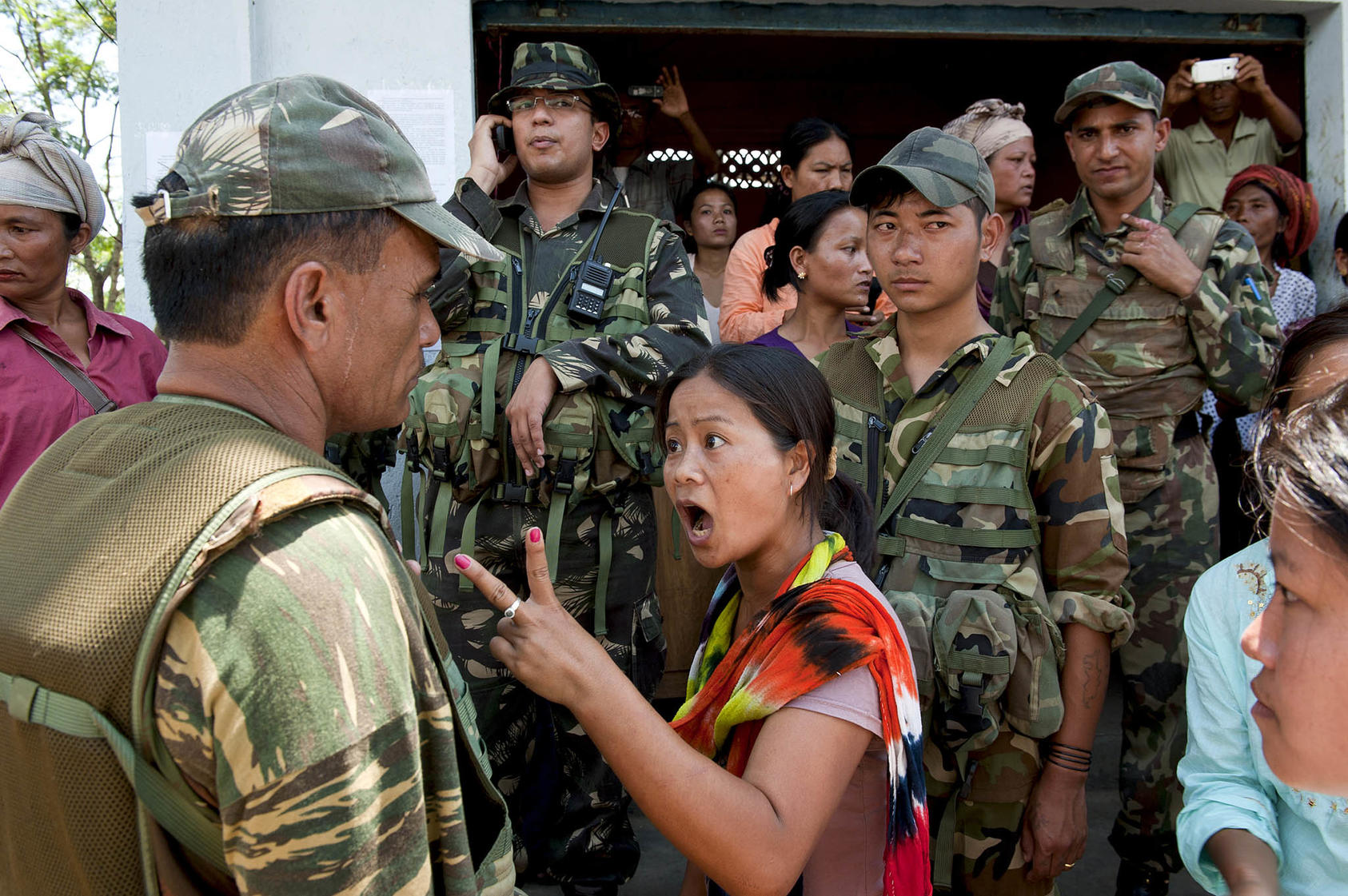 A woman gestures as she argues with an Indian army member in the village of Gamgiphai, Manipur state, India, August 31, 2011. (Manpreet Romana/The New York Times)