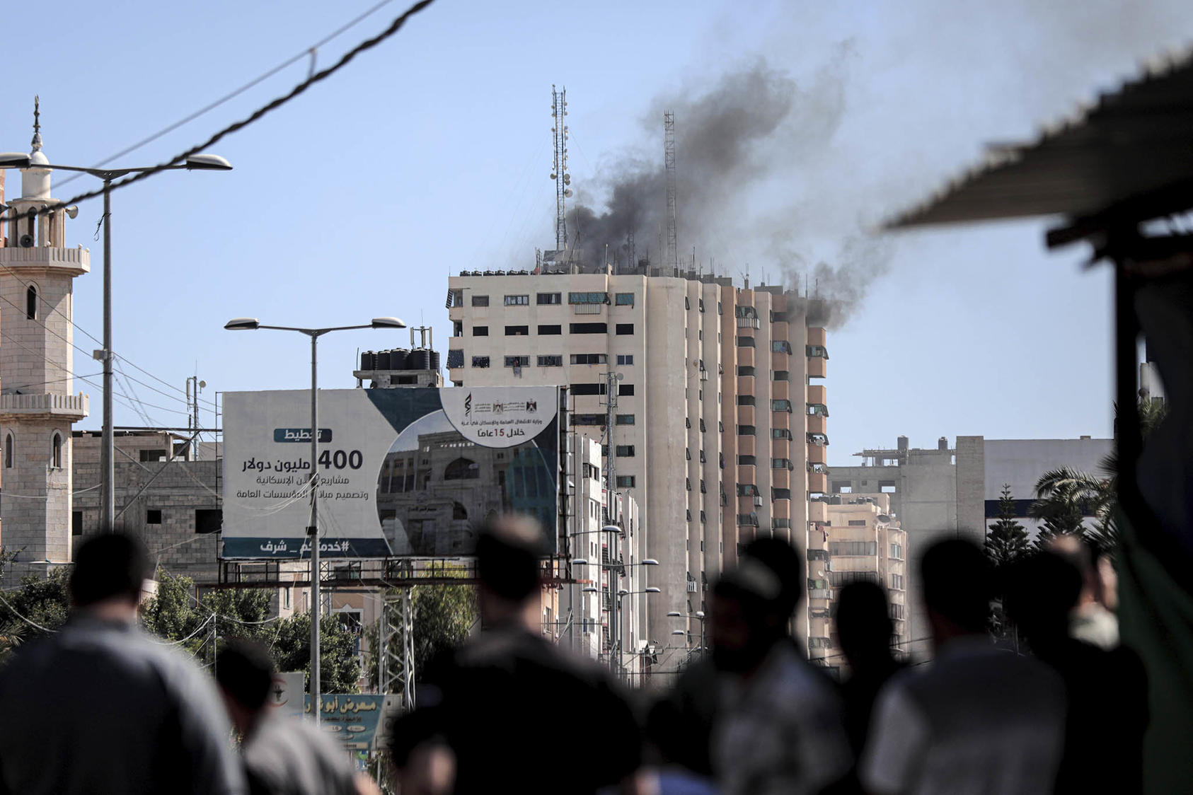 Smoke rises from a building hit by an Israeli fired rocket in Gaza City, Gaza Strip, Wednesday, May 19, 2021. (Hosam Salem/The New York Times)