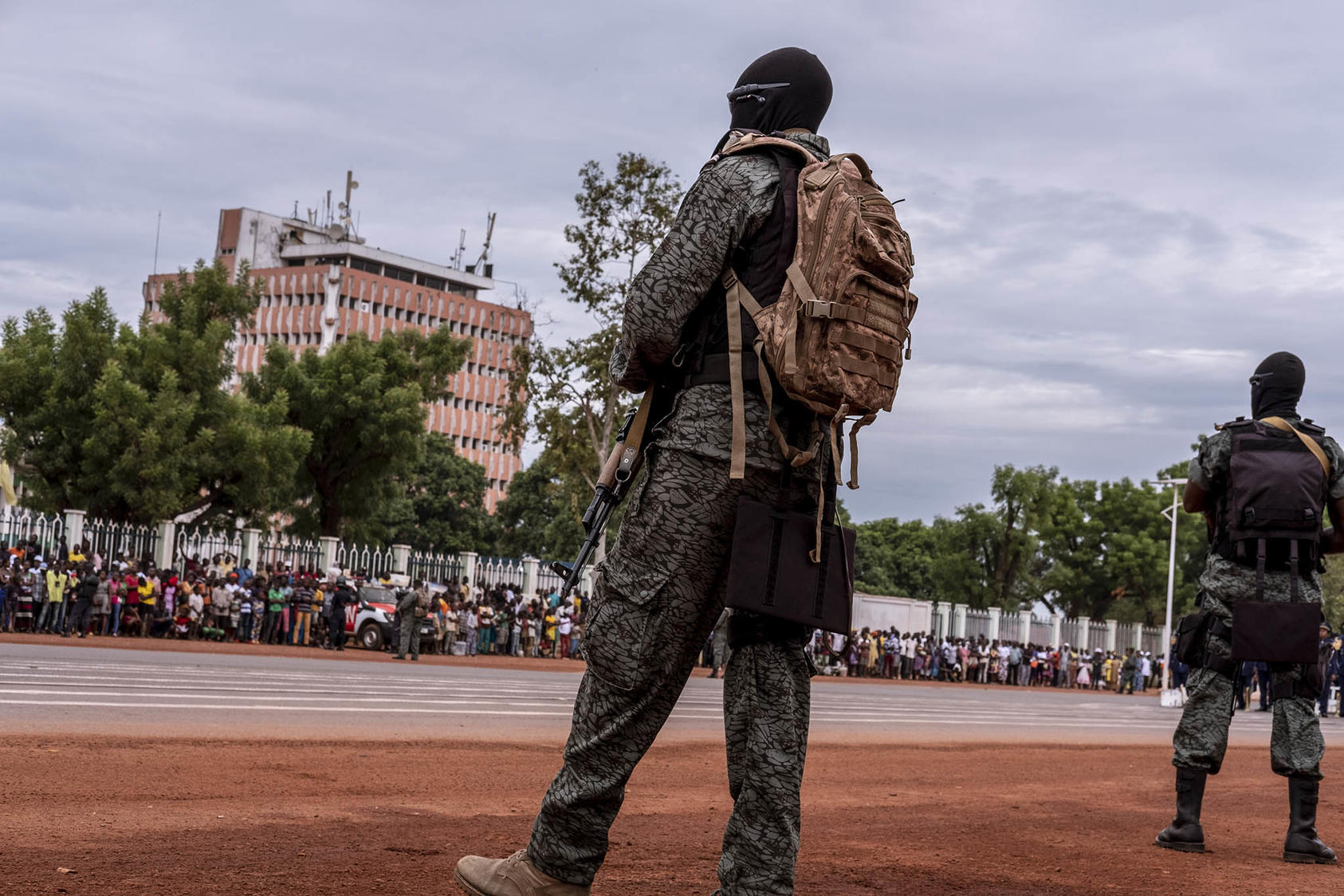 Hooded soldiers trained by Russia’s Wagner group line a parade route in the Central African Republic’s capital, in 2019. The Kremlin is reshuffling control over Wagner, one of its main tools of influence in Africa. (Ashley Gilbertson/The New York Times)