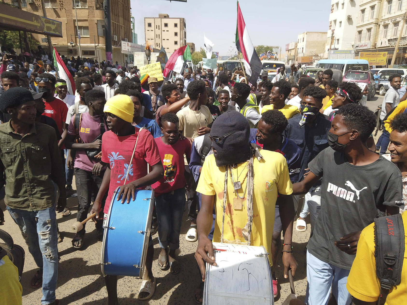 Sudanese march in the city of Omdurman last March as civilians anticipated a deadline for top generals to hand power to a civilian government. But the generals kept power — and instead went to war days later. (Faiz Abubakar Muhammed/The New York Times)