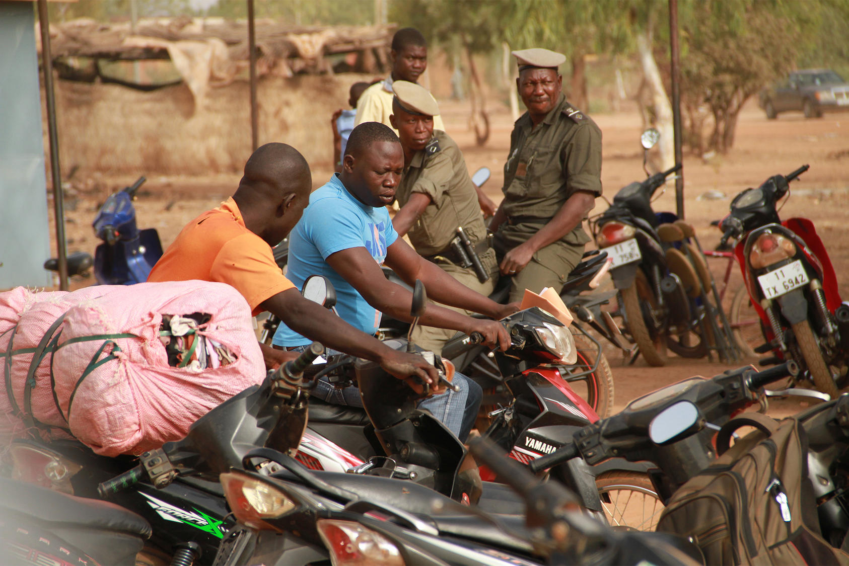 Two security officers on motorcycles in Burkina Faso - where USIP applied a systems thinking approach to help improve citizens' trust in the judiciary (USIP photo).