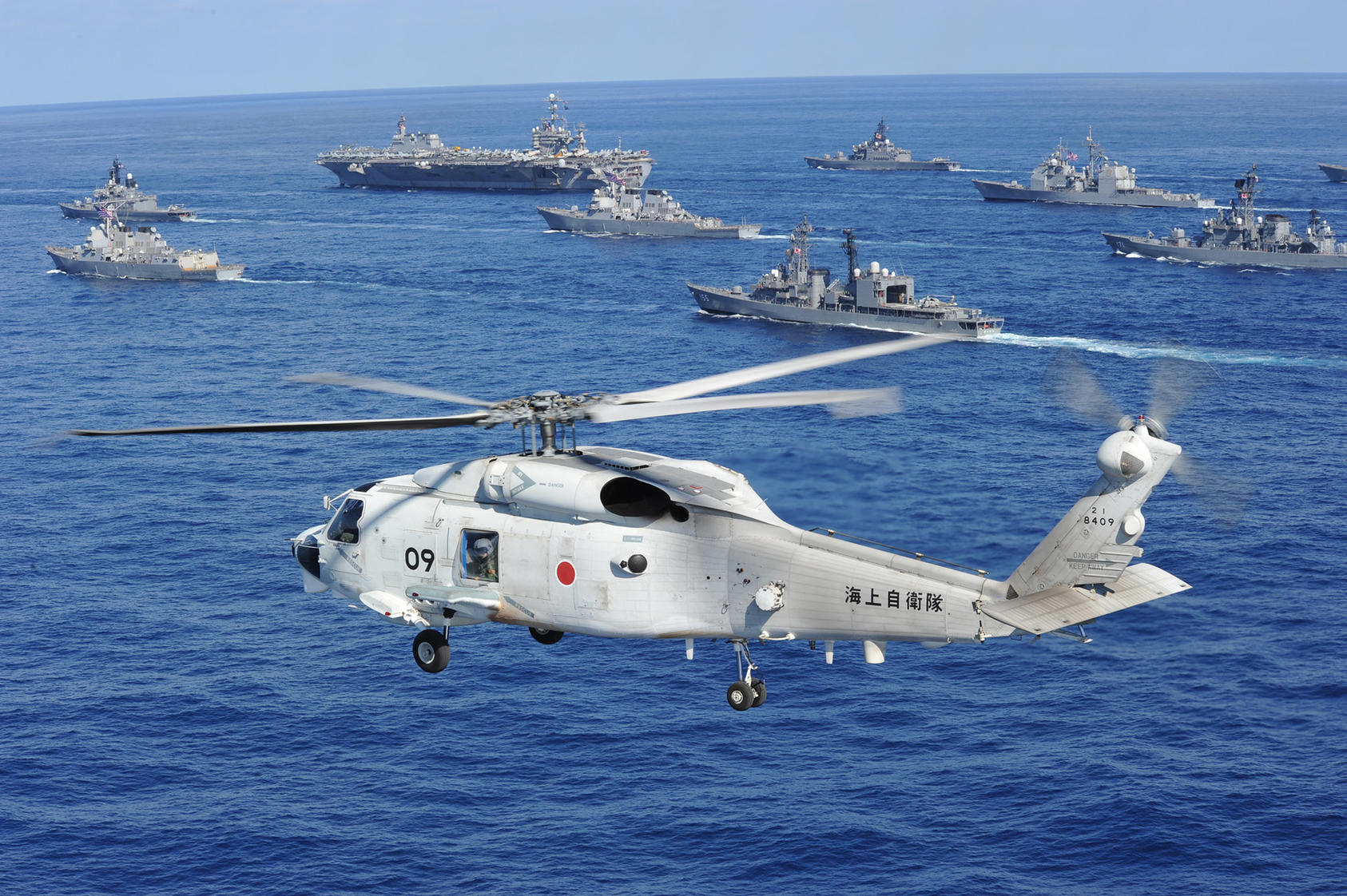 A Japan Maritime Self-Defense Force (JMSDF) helicopter conducts flight operations in the vicinity of U.S. Navy and JMSDF vessels, Dec. 10, 2010. (Japan Maritime Self-Defense Force)