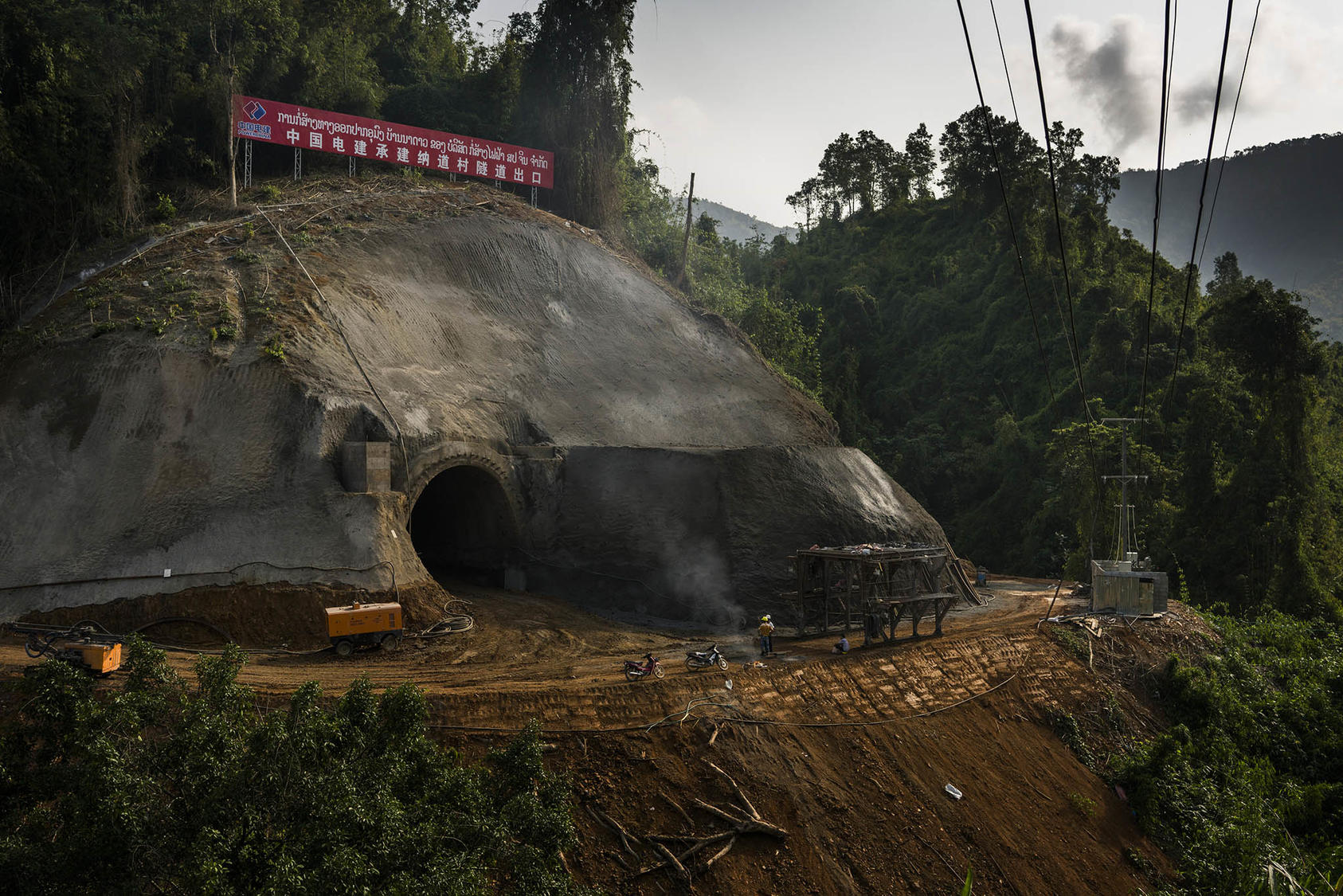 Chinese workers at the entrance to a tunnel near Vang Vieng, Laos, which is part of a railway project from China to Laos, May 8, 2017. (Adam Dean/The New York Times)