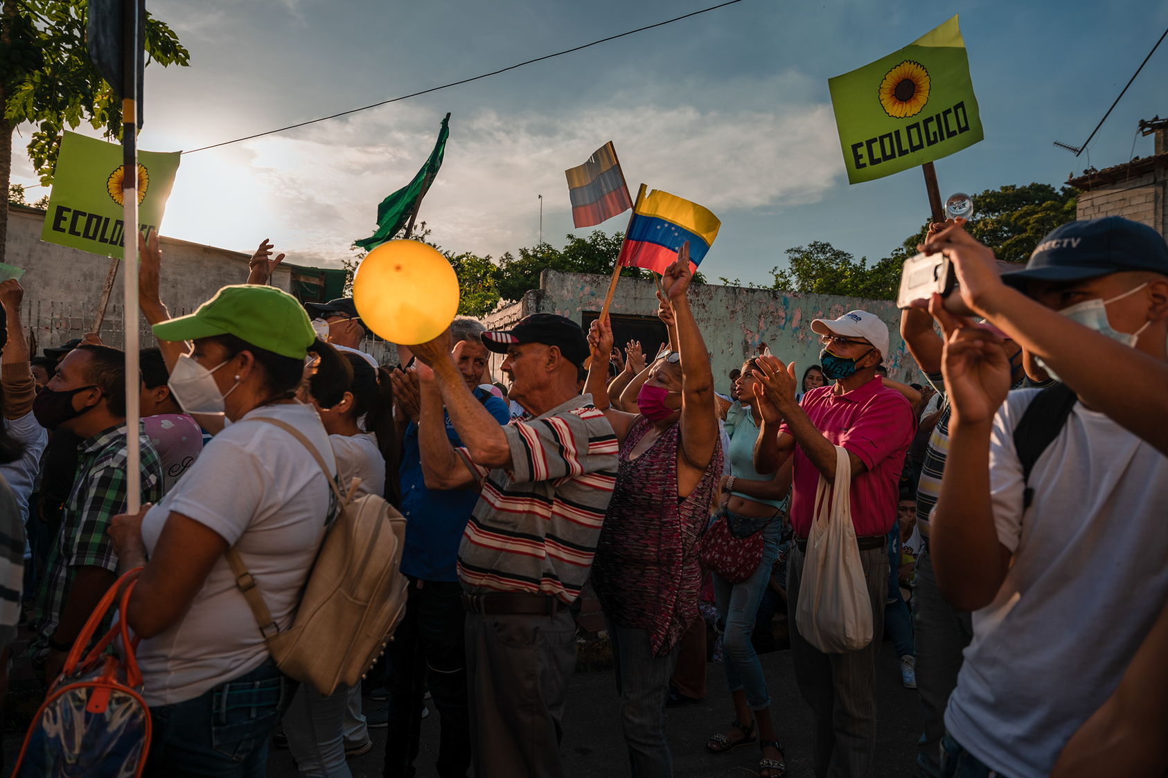 Supporters of Americo De Grazia, an opposition candidate running for the governor's office of Bolivar state, during a speech in El Palmar, Venezuela, Nov. 13, 2021. (Adriana Loureiro Fernandez/The New York Times)