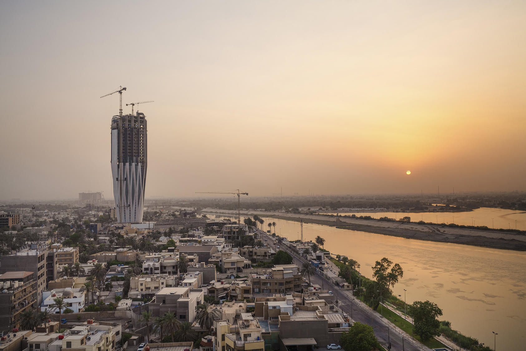 The Central Bank of Iraq tower under construction on the banks of the Tigris River in Baghdad. September 6, 2022. (Emily Garthwaite/The New York Times)