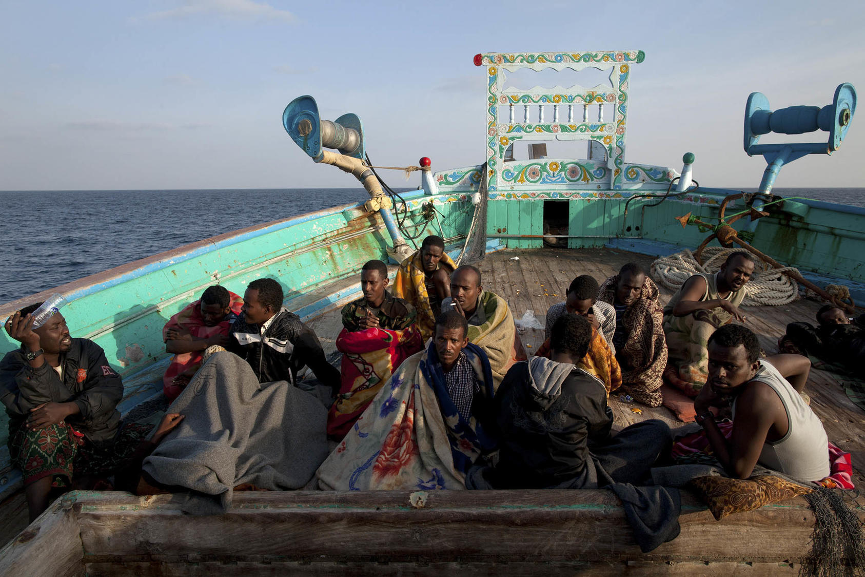 Somali pirates on a fishing vessel where they were captured by members of the U.S. Navy in the Gulf of Oman, Jan. 6, 2012. The U.S. has celebrated its collaboration with industry to stop piracy off the coast of Somalia. (Tyler Hicks/The New York Times)