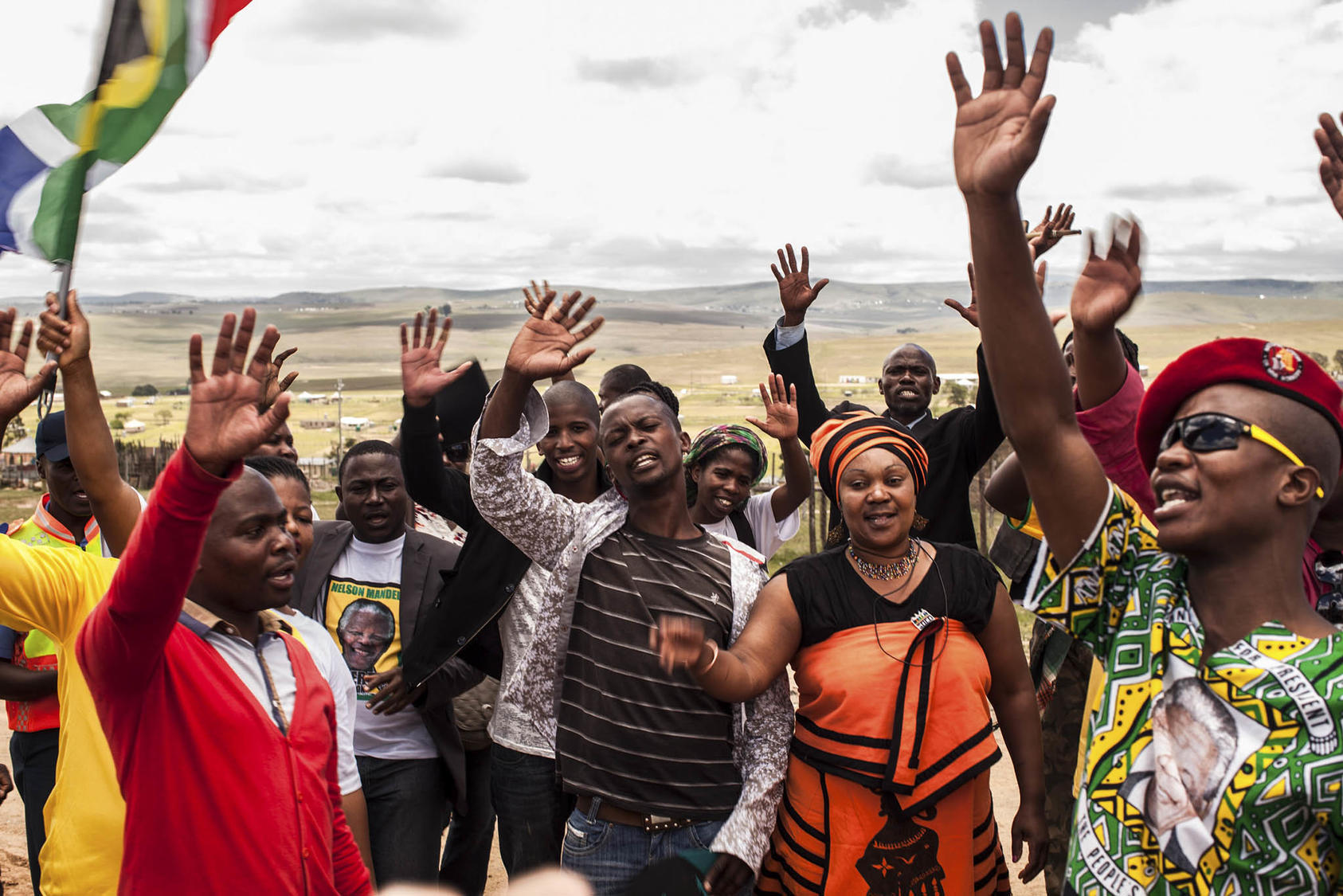 South Africans sing songs from their anti-apartheid struggle after the funeral of Nelson Mandela 10 years ago. The legacies of Mandela and the struggle he helped lead still resonate for nonviolent movements in the 2020s. (Bryan Denton/The New York Times)