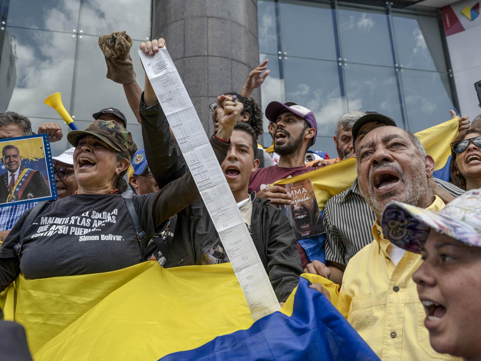 Opposition supporters hold vote tallies following July’s election during a protest in Caracas, Venezuela, July 30, 2024. (Alejandro Cegarra/The New York Times)