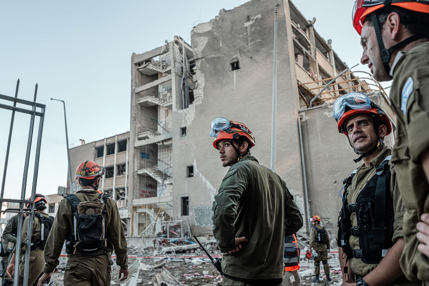 Emergency workers at the site of an Iranian missile attack in Haifa, Israel, on Friday, June 20, 2025. (Daniel Berehulak/The New York Times)
