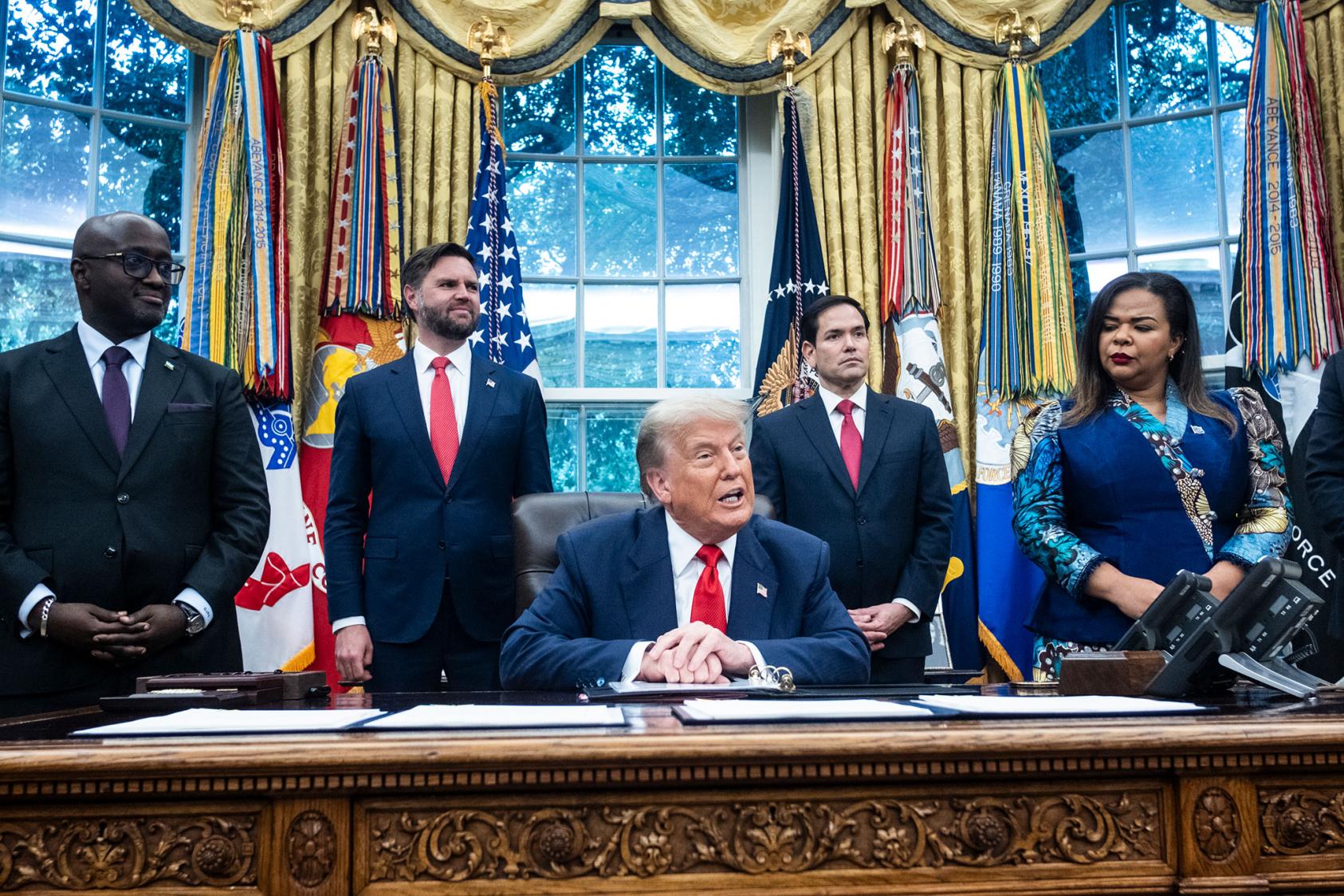 President Donald Trump speaks during an event with Foreign Minister Therese Kayikwamba Wagner of Congo, right, and Foreign Minister Olivier Nduhungirehe of Rwanda, left, at the White House. June 27, 2025. (Pete Marovich/The New York Times)