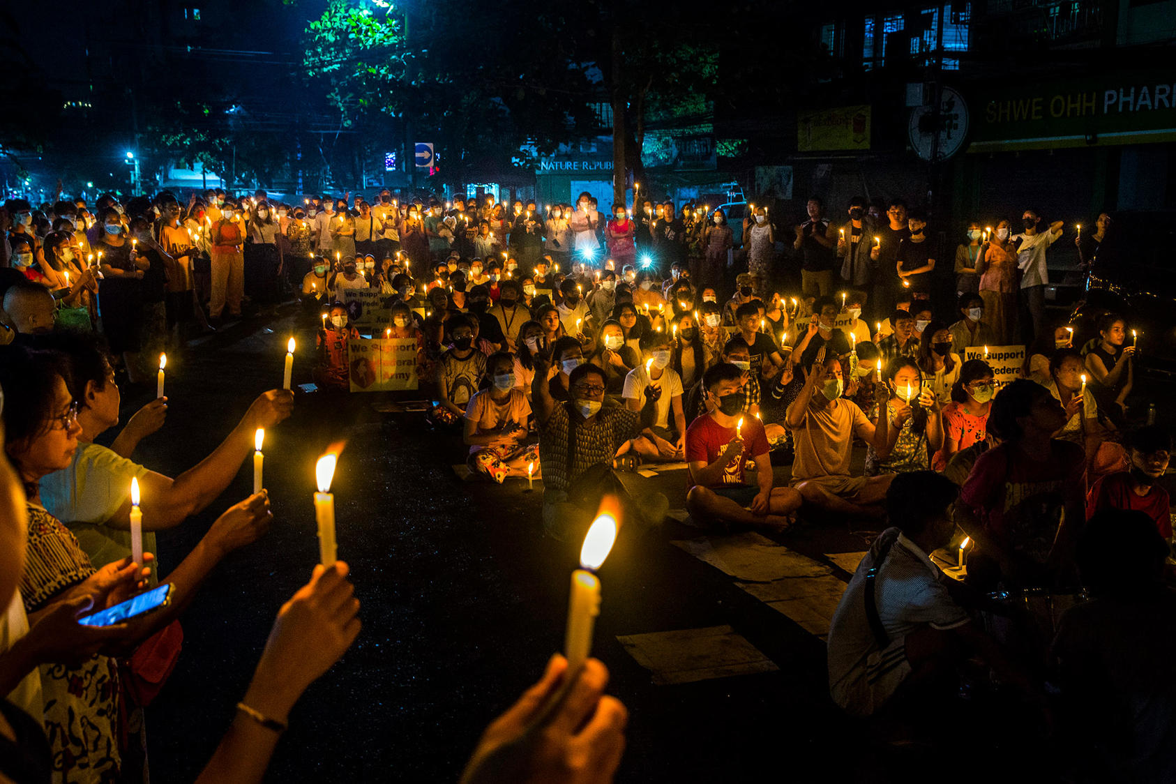 A candlelight vigil in Yangon, Myanmar, on April 3, 2021, to protest the military’s ouster of the civilian government. Since the coup in February, nearly 900 civilians have been killed. (The New York Times) 