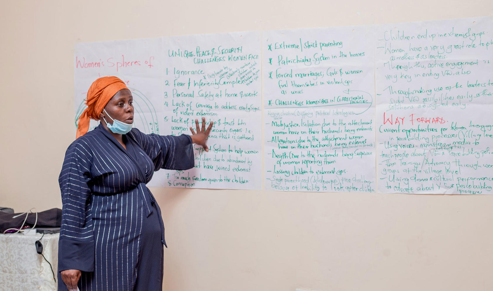 A project staffer explains the relevance of the dialogues to participants at the Women Preventing Violent Extremism community dialogues organized by USIP's Partner Sisters Without Borders in Uganda.
