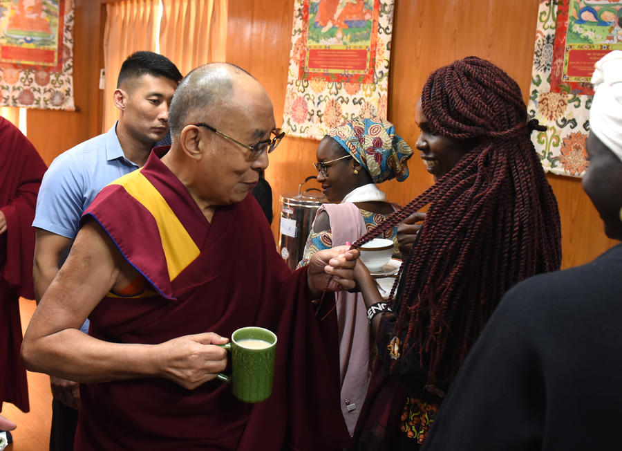 His Holiness the Dalai Lama here with Adeng, a journalist and human rights from South Sudan
