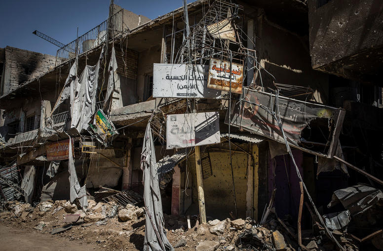 A sign points the way to a centuries-old church in Mosul that the Islamic State turned into a religious police headquarters in Mosul, Iraq, Sept. 9, 2017. (Ivor Prickett/The New York Times)