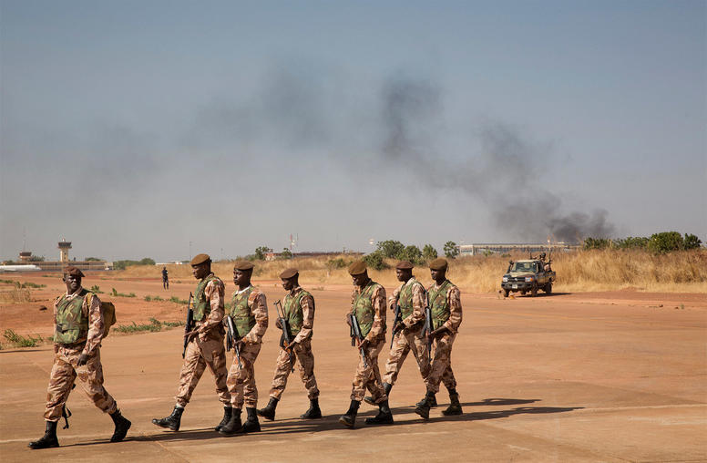 Malian soldiers patrol an airbase in Bamako, Mali, Jan. 16, 2013. (Marco Gualazzini/The New York Times)