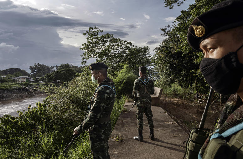 Thai solders on patrol in the border town of Mae Sot, which sits directly across the Moei River from Myawaddy, Myanmar, on Sept. 28, 2020. (Adam Dean/The New York Times)