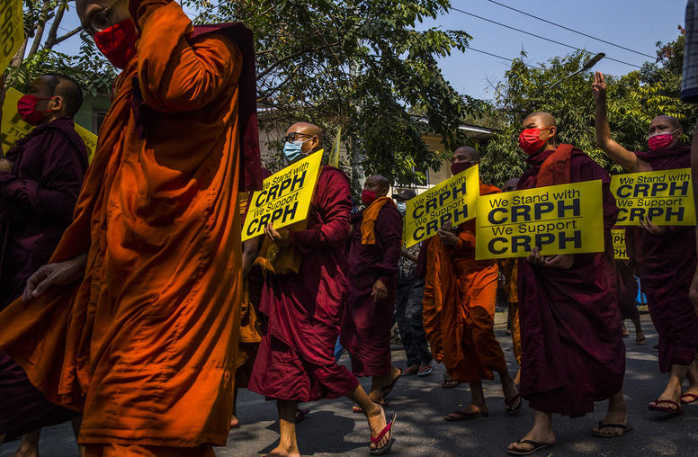 Buddhist monks protest the army coup of Myanmar in Mandalay, Feb. 27, 2021. However, monks have been less involved than they were in previous movements, such as the monk-led 2007 Saffron Revolution. (The New York Times)