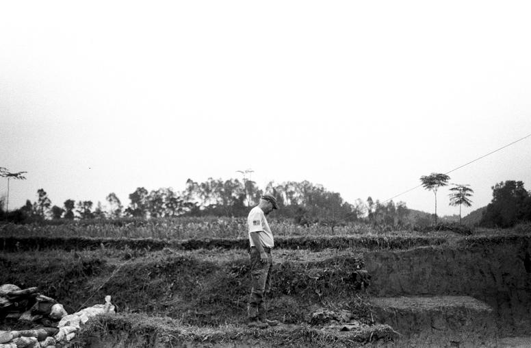 Hugh Tuller, an anthropologist with the Defense POW/MIA Accounting Agency, examines a dig site during a recovery mission in Nghe An province, Vietnam. November 29, 2017. (Staff Sgt. Matthew J. Bruch/U.S. Air Force)