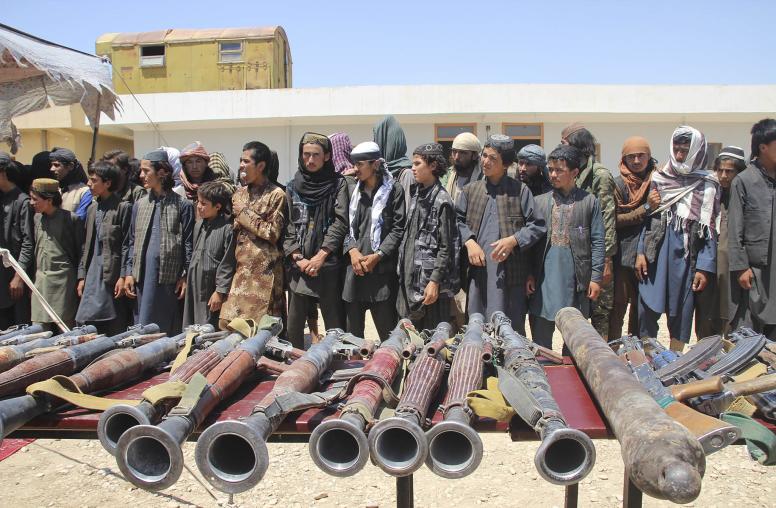 More than 250 Islamic State fighters turn themselves in to the Afghan government to avoid imminent capture by Taliban insurgents, in Sheberghan, Afghanistan, Aug. 1, 2018. (Najim Rahim/The New York Times)
