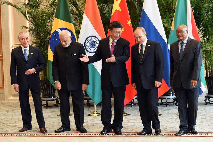 Xi (center) and Putin (center right) with the leaders of Brazil, India and South Africa at the 2016 BRICS summit in South Africa. Xi and Putin want to advance a multilateral order to supplant what they see as U.S. dominance. (South African Government)
