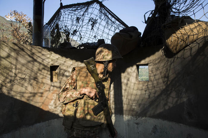 A Pakistan soldier stands guard at the line of control, the unofficial border between India and Pakistan that runs through Kashmir, on Sept. 6, 2019. (Saiyna Bashir/The New York Times)