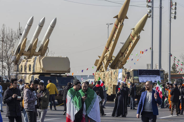 Citizens walk near missile carriers and other weapons displayed during an event marking the 45th anniversary of Iran’s Islamic Revolution in Tehran, Iran, on Sunday, Feb. 11, 2024. (Arash Khamooshi/The New York Times)