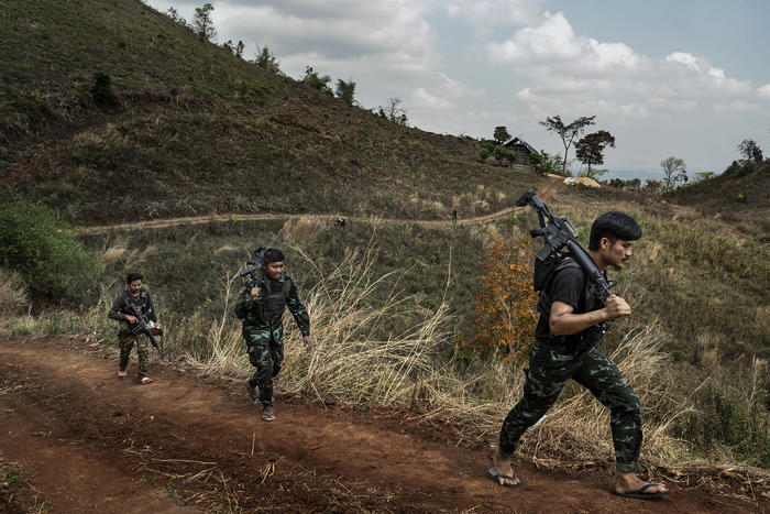 Rebel militia fighters of the People’s Defense Forces patrol a frontline area near government military positions in the Kayin State of Myanmar, March 9, 2022. (Adam Dean/The New York Times)