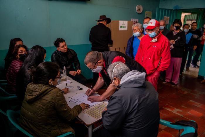 Voters cast their ballots in Colombia’s presidential election in Bogotá, Colombia on Sunday, June 19, 2022 (Federico Rios/The New York Times)