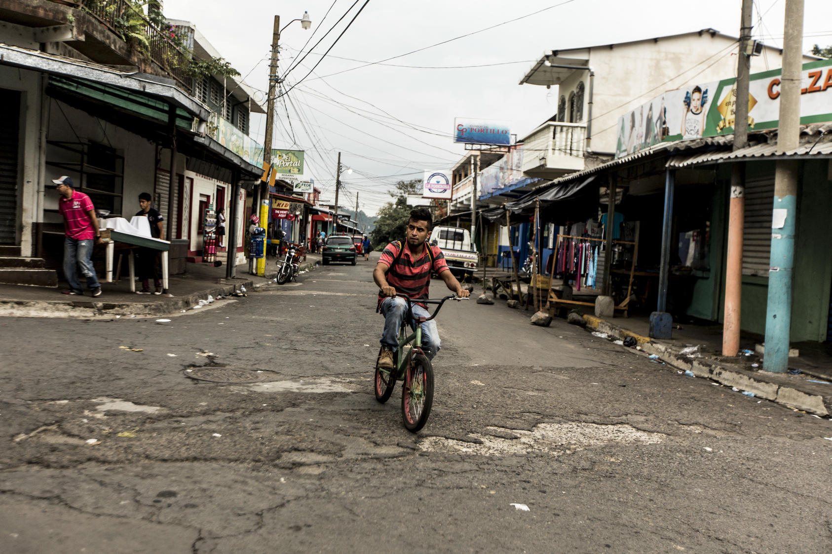 A bicyclist in Berlín, a town in El Salvador where gangs are somewhat less of a problem than in the larger cities