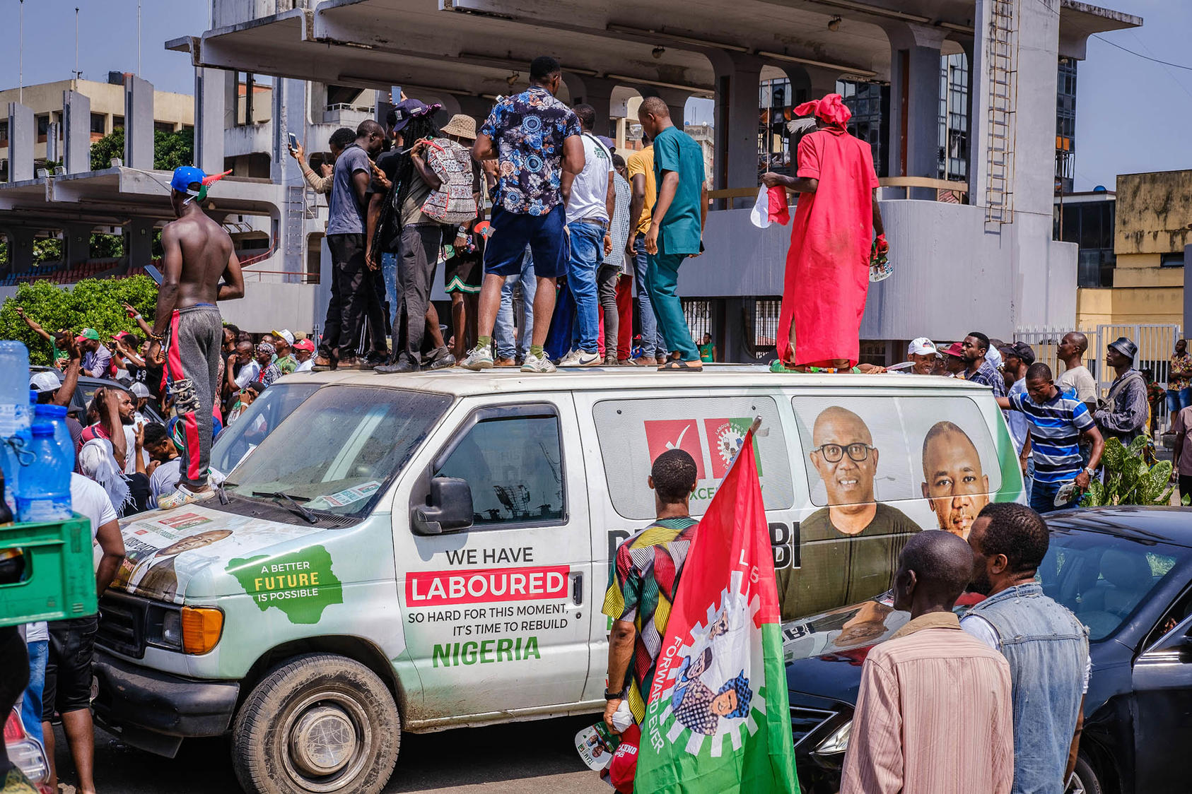 Young Nigerians stand on a campaign van to watch a rally for the third-party candidate in February’s presidential election. Nigerian youth, a majority of the population, are fueling demands for a more responsive democracy. (Taiwo Aina/The New York Times)